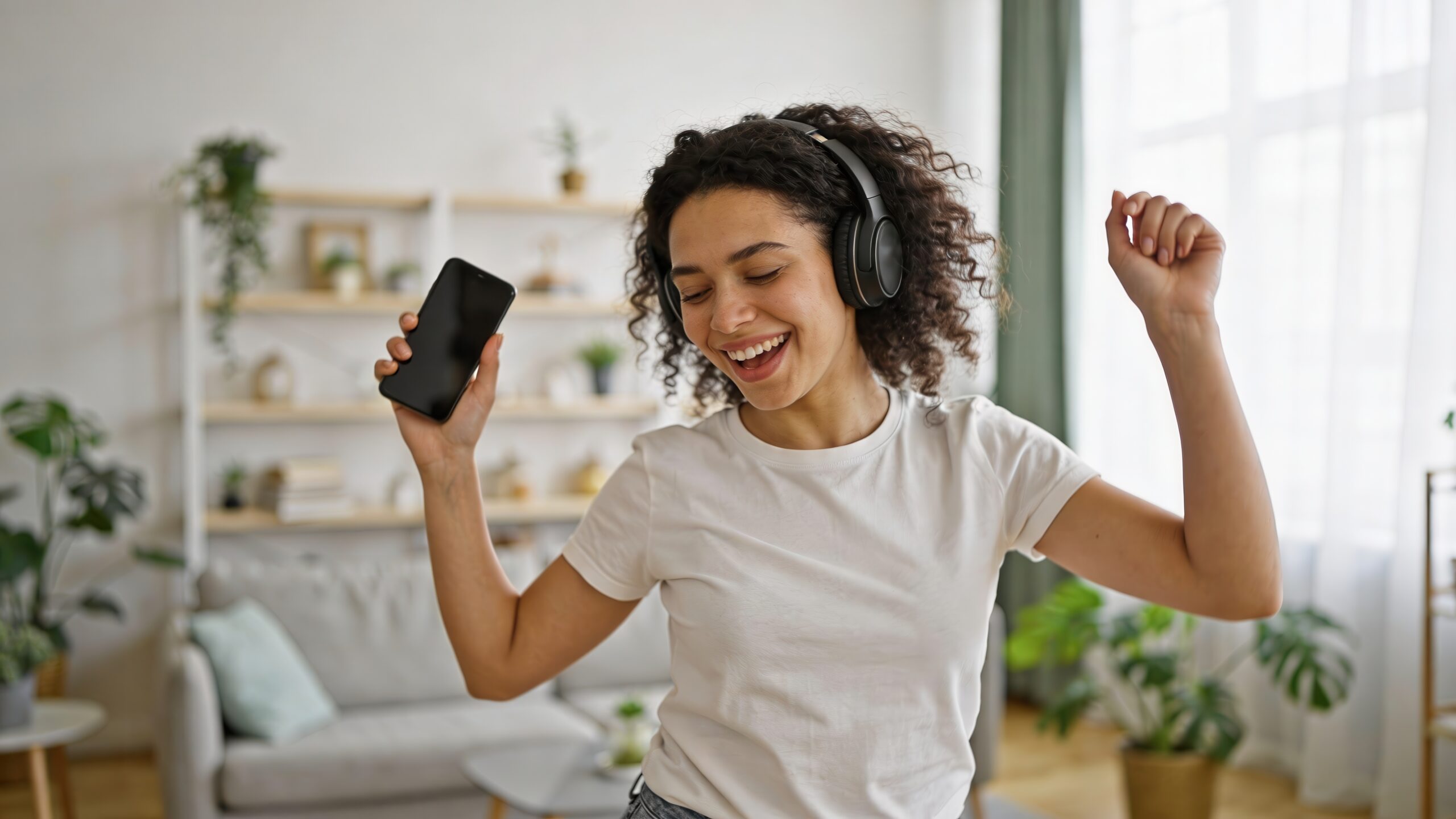 vecteezy young woman with curly hair dances joyfully while listening 81267026 1 scaled